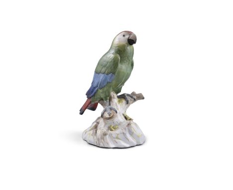 A 19TH CENTURY MEISSEN PAINTED PORCELAIN MODEL OF A GREEN PARROTstanding on a tree trunk, with underglazed blue crossed sword
