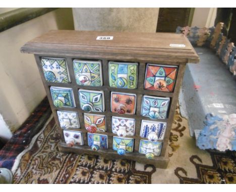 A SPICE RACK WITH PORCELAIN DRAWERS  AF