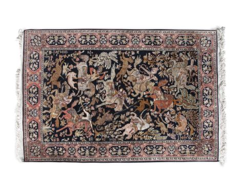 A MODERN PERSIAN WOOL RUG, the black ground decorated with hunting scene, with multiple hunters on horseback within border an
