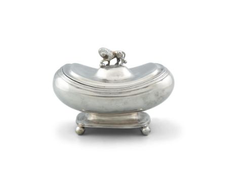 A CONTINENTAL WHITE METAL BOX, of oblong boat shape, the hinged lid with cast finial in the form of a Medici Lion, raised on 