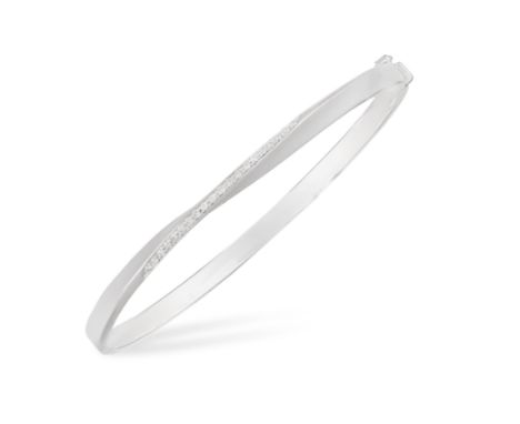 A DIAMOND BANGLE, of polished white gold highlighted with a line of brilliant-cut diamonds at the centre, mounted in 18K gold