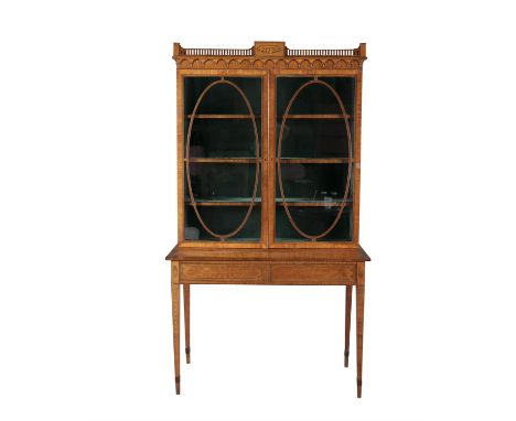 AN EDWARDIAN INLAID SATINWOOD TWIN GLAZED DOOR DISPLAY CABINET, on table base, fitted two drawers. 201 x 113.5 x 53cm deepCon