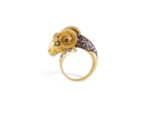 AN ENAMEL AND GOLD RING, realistically modelled as a ram's head, the body and eyes embellished with blue enamel, the horns wi