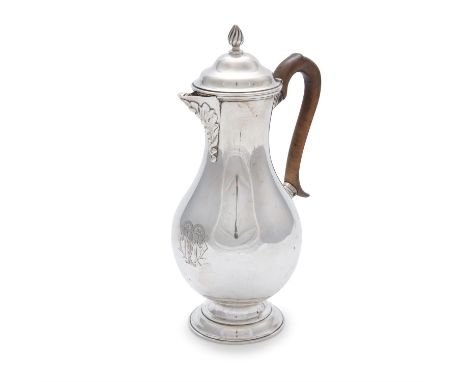 A GEORGIAN REVIVAL SILVER HOT WATER POT, London c.1904, of plain baluster form with walnut handle and domed cover, surmounted