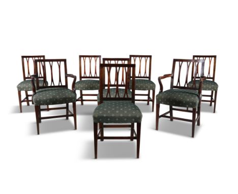 A SET OF EIGHT IRISH MAHOGANY FORK-BACK DINING CHAIRS, comprising two carvers, and six single chairs, each with square open b