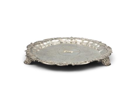 A GEORGE III SILVER SALVER, London c.1824, mark of Robert Hennell II, of circular form, with floral cast rim, later engraved 