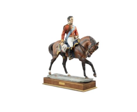 A ROYAL WORCESTER PORCELAIN MODEL OF WELLINGTON, modelled by Bernard Winskill, model no.23/750, set into a walnut and brass i