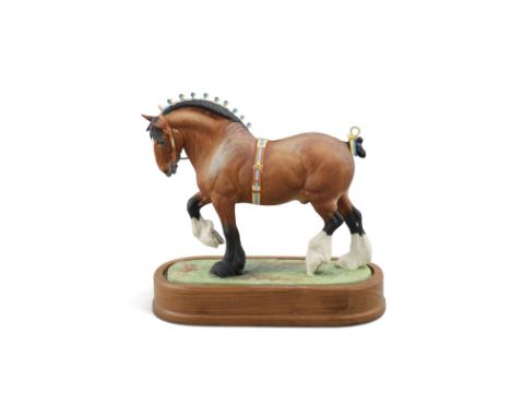 A ROYAL WORCESTER PORCELAIN MODEL OF A SHIRE STALLION, modelled by Doris Lindner, model no.193/500, set into an oval timber b
