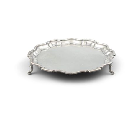 A SILVER SALVER, Sheffield c.1929, maker's mark of R F Mosely & Co., of shaped circular form, with pie crust rim and plain re