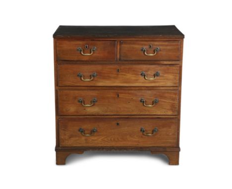 ***PLEASE NOTE THIS LOT IS 98CM HIGH***A GEORGE III MAHOGANY COMPACT CHEST, the rectangular top with reeded rims, above two s