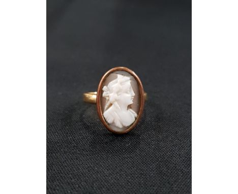 18 CARAT GOLD RING WITH LATER ADDED CAMEO IN YELLOW METAL MOUNT 