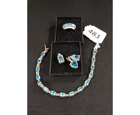 SUITE OF 9 CARAT GOLD AND BLUE TOPAZ JEWELLERY TO INCLUDE PAIR OF EARRINGS, PENDANT, RING AND BRACELET 