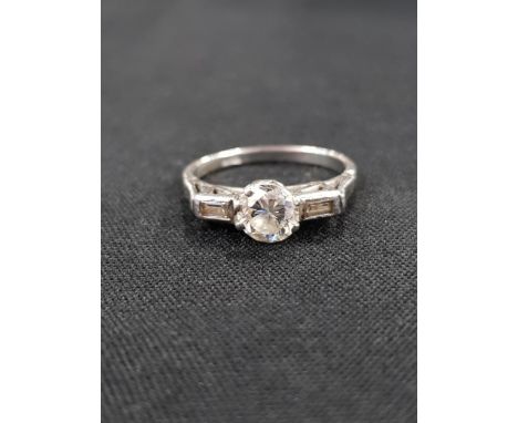 PLATINUM AND DIAMOND RING CENTER STONE CIRCA 0.66 TOTAL DIAMOND WEIGHT CIRCA 0.75 CARAT 