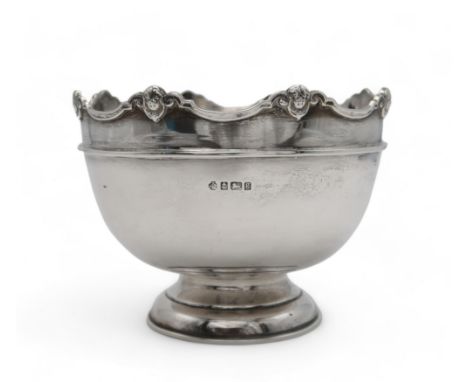 AN EDWARDIAN SILVER ROSE BOWL by William Hutton &amp; Sons, Birmingham 1906, with an applied cherub border, on a circular bas