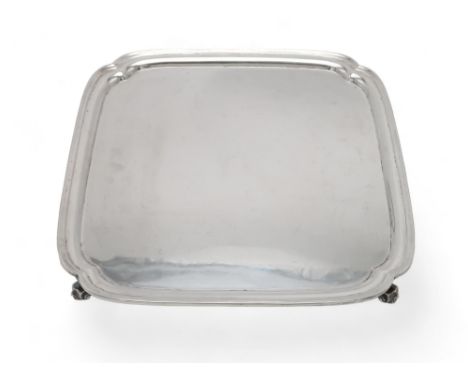 A GEORGE V SILVER SALVER by Robert Stewart, Sheffield 1933, of shaped square form, on four acanthus scroll feet, inscribed to