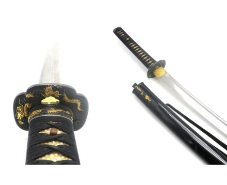 A FINE JAPANESE KATANA With ornately cast bronze mounts throughout featuring gilt dragons; the white shagreen grip with black
