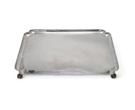 A HEAVY GEORGE V SILVER TRAY by R &amp; W Sorley, London 1914, of shaped rectangular form, on four acanthus scroll feet, the 