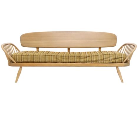 A MID 20TH CENTURY ERCOL BLONDE ELM AND BEECH DAY BED&nbsp; with removable back rest over upholstered cushion flanked by rail