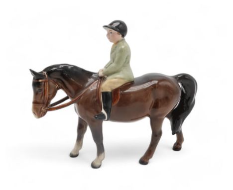 BESWICK BOY ON BROWN PONY wearing a green jacket, model 1500 Condition Report:All over light crazing. No obvious chips, crack