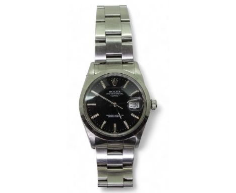 A ROLEX OYSTER PERPETUAL DATE in stainless steel, with black dial, silver coloured baton numerals and hands. Serial number 72