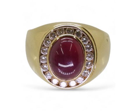 A GENTS RUBY &amp; DIAMOND RING mounted in bright yellow metal stamped 750, the cabochon ruby is approx 10mm x 7.7mm x 5.8mm.