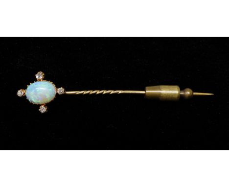 AN OPAL AND DIAMOND PIN set with a lively 10mm x 7mm x 3.5mm opal with four old cut diamond accents. weight 2.6gms. Has a gol