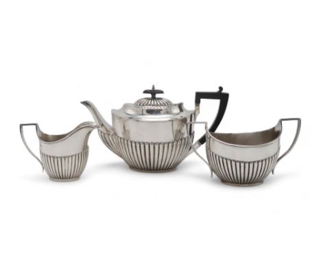 A GEORGE V THREE PIECE SILVER TEA SERVICE by James &amp; William Deakin, Sheffield 1924, in the Queen Anne style, the bodies 