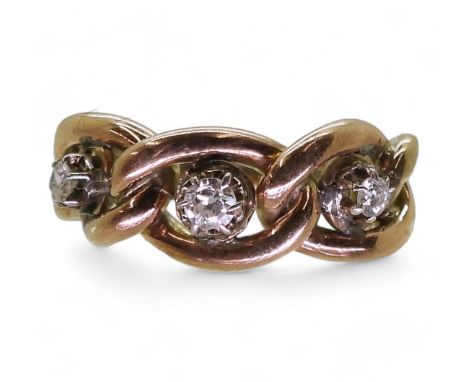 A CHAIN PATTERN RING made in yellow metal and set with three old cut diamonds, with an estimated total of 0.20cts, finger siz