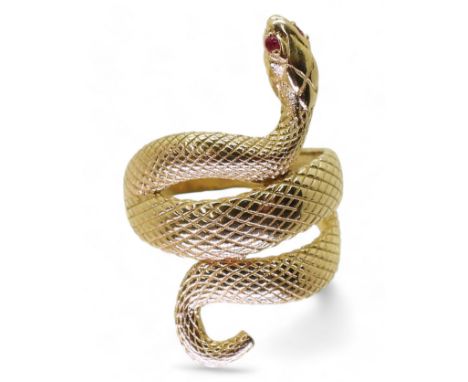 A 14K GOLD SNAKE RING the highly textured snake has ruby eyes, with lasered hallmark 585, finger size R1/2, weight 5.8gms Con