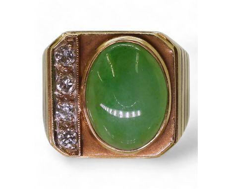 A CHINESE GREEN HARDSTONE RING a gents ring set with a cabochon hardstone of 15mm x 11mm x 4.3mm, and four brilliant cut diam