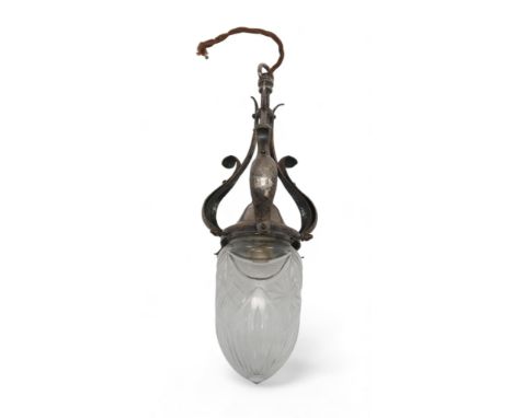 AN ARTS AND CRAFTS SILVERED BRASS HALL LIGHT with three S scrolls with hammed decoration and cut glass shade, 44cm drip Condi