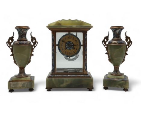 A FRENCH CHAMPLEVE ENAMEL AND ONYX CLOCK GARNITURE the clock of rectangular form with gilded dial, black Arabic numerals, the