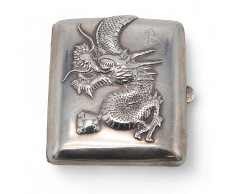 A CHINESE EXPORT SILVER CIGARETTE CASE maker's mark C J Co, of rectangular form, decorated in relief with a dragon clutching 