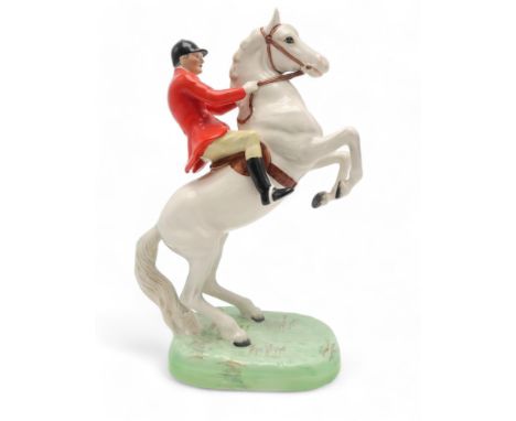 A BESWICK HUNTSMAN ON WHITE REARING HORSE model 868, printed and impressed marks to base Condition Report:light crazing