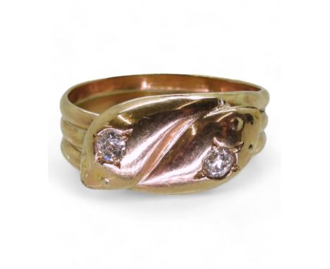 A 9CT GOLD SNAKE RING the double heads are set with 0.28cts of old cut diamonds combined. Chester hallmarks for 1878. Finger 
