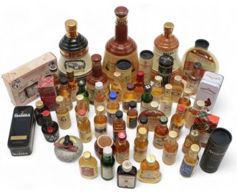 SCOTCH WHISKY&nbsp; Bell's Decanter Christmas 1990 together with whisky miniatures and empty whisky souvenir flasks Condition