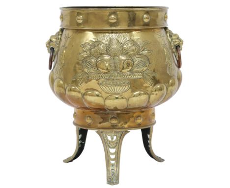 A DUTCH BRASS PLANTER&nbsp; with bulbous body embossed with armorial crest to one side and fruit/foliate motif to verso these