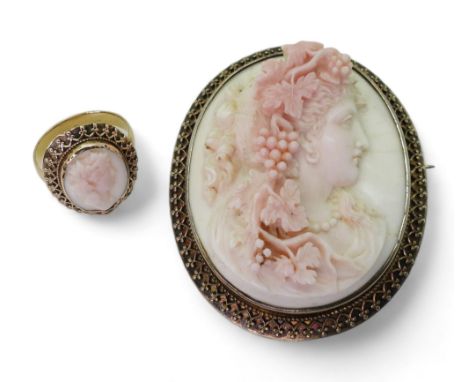 CONCH SHELL CAMEOS the well carved cameo of a follower of Bacchus is mounted in a decorative gilded white metal brooch mount,