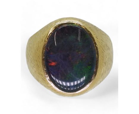 A 18K GOLD OPAL RING set with a 16mm x 12mm, opal triplet. Finger size S1/2, weight 11.4gms&nbsp; Condition Report:Available 