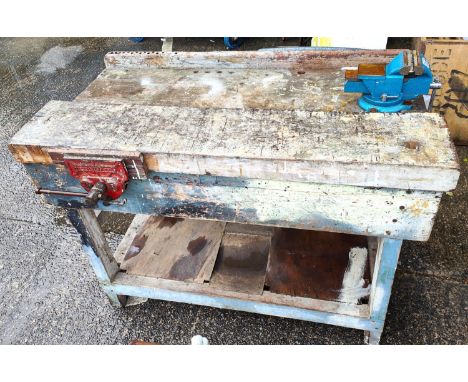 A vintage work bench with attached clamps, vintage cupboard with tools, chisels etc 