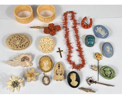 A selection of vintage costume jewellery:- Cameo brooches and pendant; carved bone brooches, a coral necklace and 2 similar b