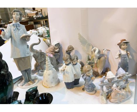 A selection of Lladro and Nao figures of animals and other figures (some missing fingers etc.) 