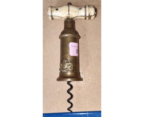 A 19th century double twist corkscrew in brass with bone handle 