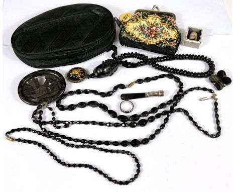 Vintage costume jewellery including a large oval pierced jet type brooch depicting a church, a similar bead necklace with sna