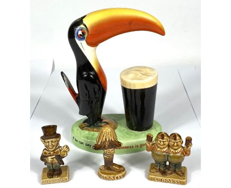 A vintage Carlton Ware Guinness advertising toucan lamp (no fittings) and three smaller Guinness advertising pieces 