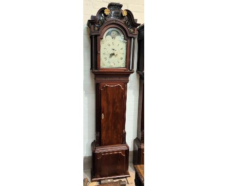 An 18th century figured mahogany longcase clock by Thomas Atkinson Ormskirk dated 1778, the hood with blind fret pediment and