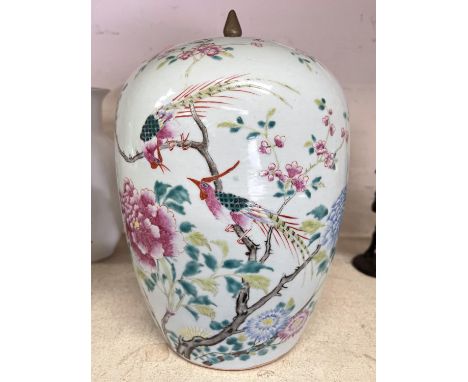 A 19th century Chinese large covered jar decorated in the famille rose manner with birds on flowering branches, height 31cm (