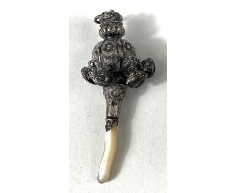 A vintage rattle with mother-of-pearl handle 