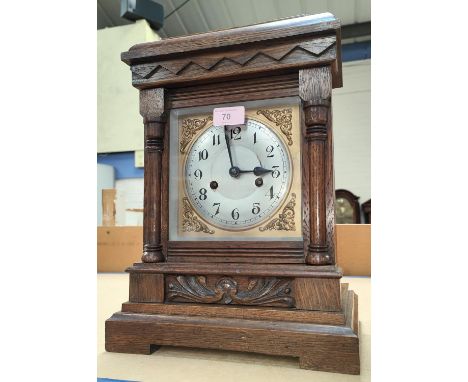 An Edwardian oak cased mantel clock with strike 