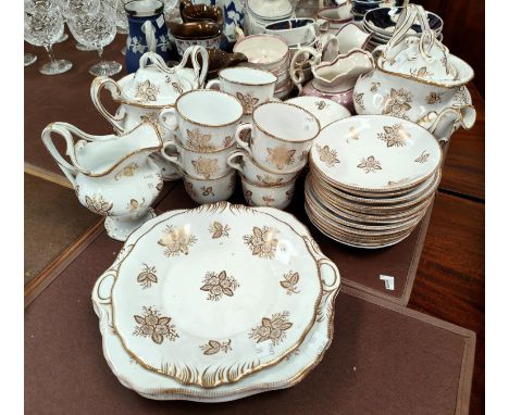 A 19th century part tea service with teapot, sugar etc in white with gilt floral decoration, approx. 28pc 